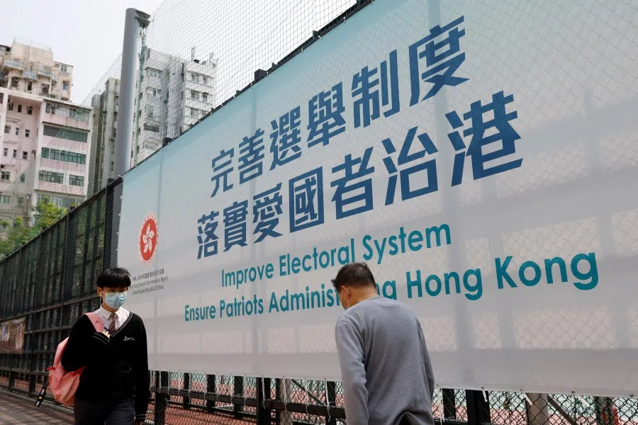 A government advertisement promoting Hong Kong electoral reforms is seen before the Chinese parliament meeting, in Hong Kong, China, 26 March 2021. (Tyrone Siu/Reuters)