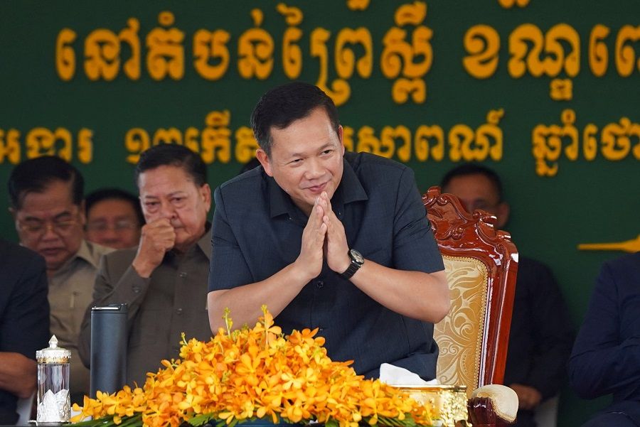 Cambodia's Prime Minister Hun Manet poses for pictures, as he attends an event to meet with garment workers on his first public appearance since taking office, on the outskirts of Phnom Penh, Cambodia, 29 August 2023. (Cindy Liu/Reuters)