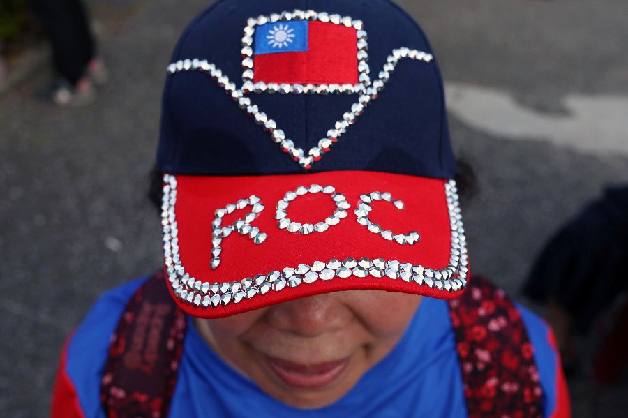 A supporter wearing a hat with a Taiwanese flag attends a campaign rally for Taiwan's KMT presidential candidate Han Kuo-yu, in Kaohsiung, Taiwan, on 21 December 21 2019. (Ann Wang/Reuters)