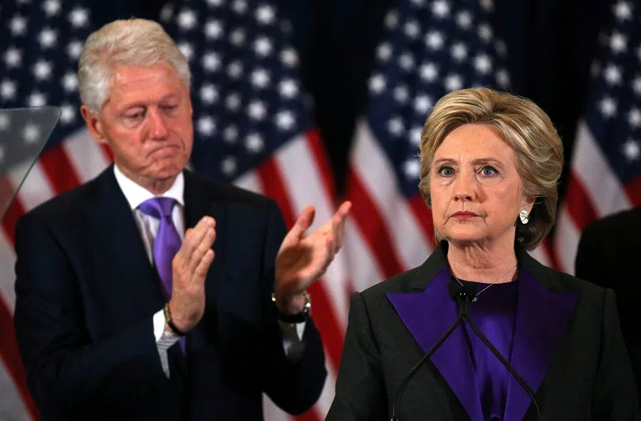 Hillary Clinton addresses her staff and supporters about the results of the US election as her husband, former US President Bill Clinton, applauds at a hotel in the Manhattan borough of New York, US, 9 November 2016. (Carlos Barria/File Photo/Reuters)