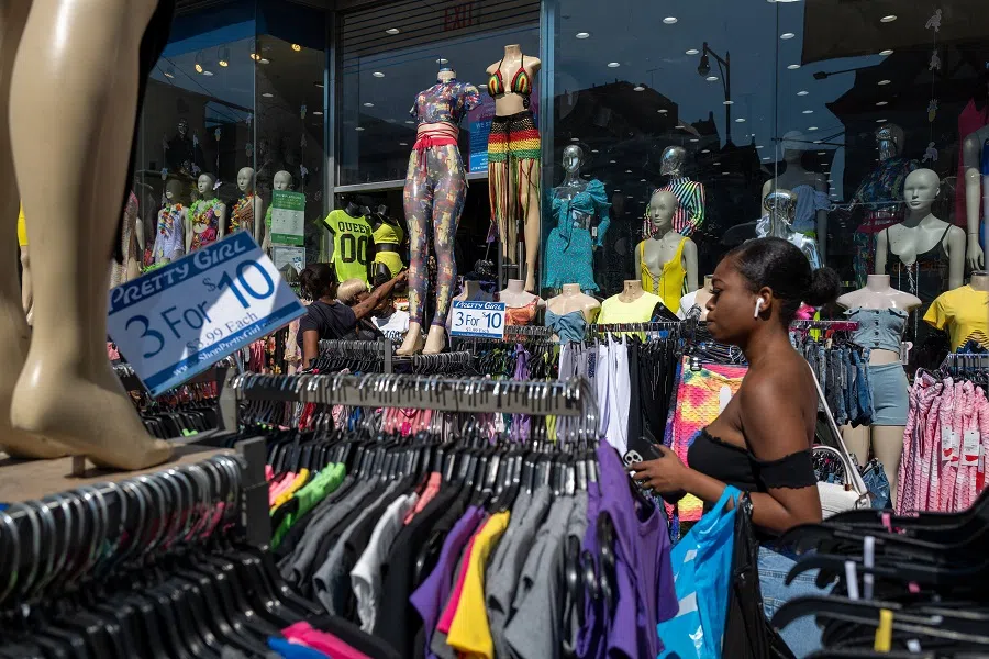 People walk along a busy shopping street in the Flatbush neighborhood of Brooklyn on 15 June 2022 in New York City, US. (Spencer Platt/Getty Images)