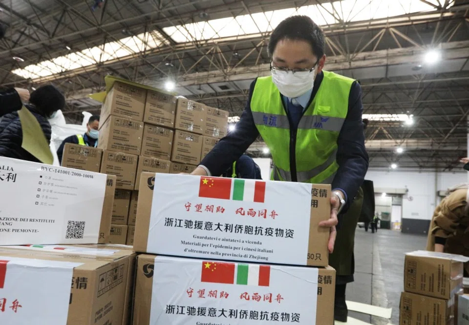 Staff members move medical supplies to be sent to Italy, at a logistics center of the international airport in Hangzhou, March 10, 2020. (China Daily via REUTERS)