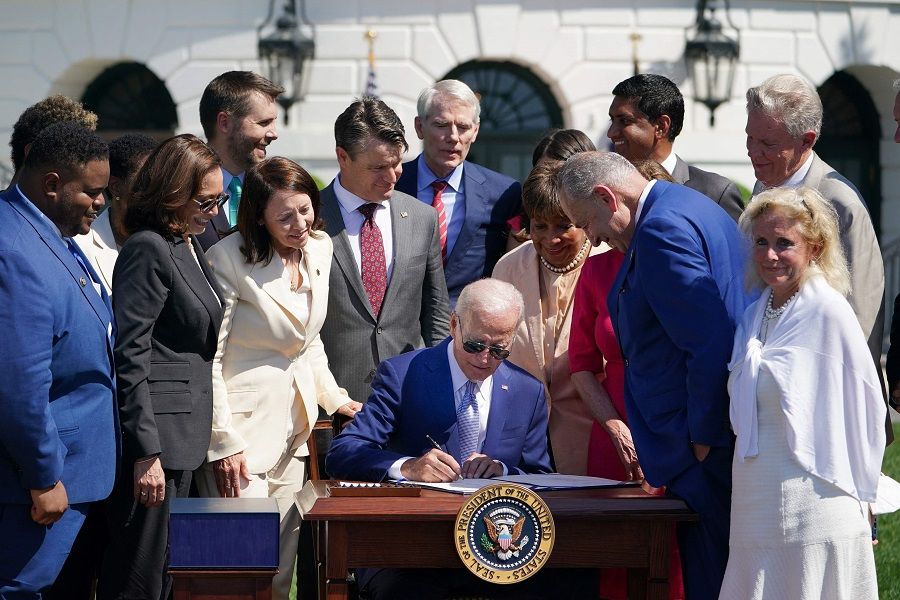 US President Joe Biden signs the CHIPS and Science Act of 2022, on the South Lawn of the White House in Washington, DC, US, on 9 August 2022. (Mandel Ngan/AFP)