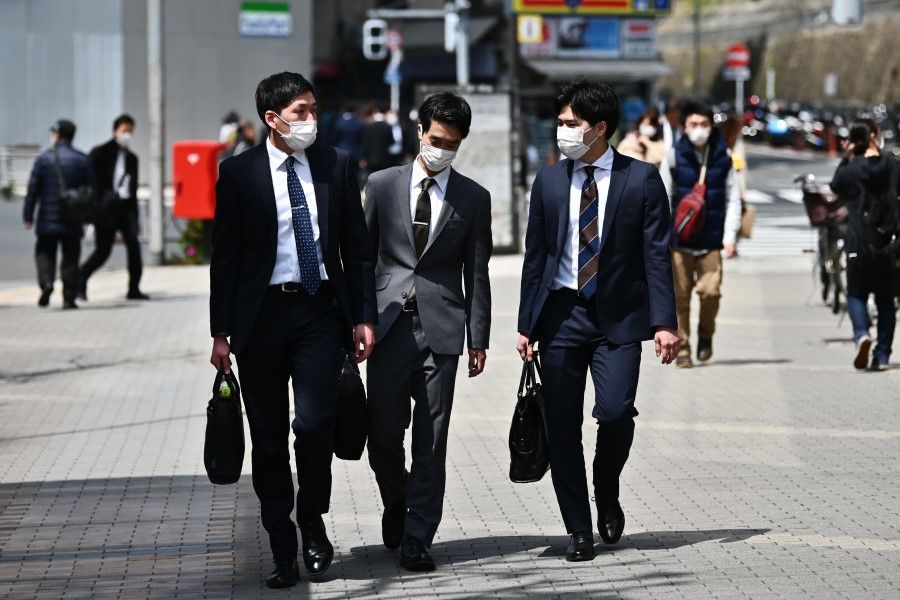 People in Tokyo's Gotanda area, April 7, 2020. Japan's Prime Minister Shinzo Abe declared a state of emergency in parts of the country, including Tokyo, over a spike in coronavirus infections. (Charly Triballeau/AFP)