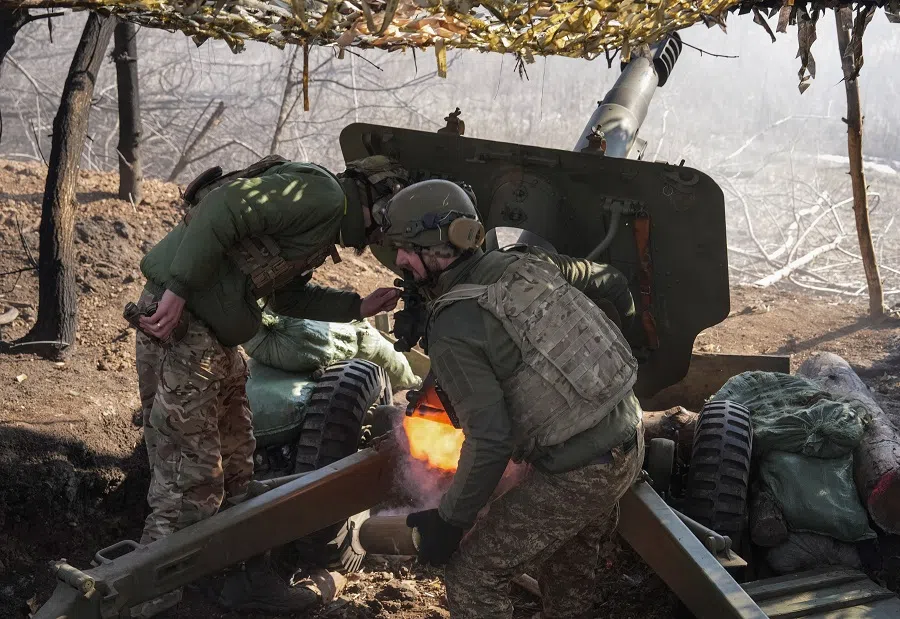 Servicemen of the 14th Assault Brigade Chervona Kalyna of the Ukrainian National Guard fire an OTO Melara howitzer towards Russian troops at a position in a front line, amid Russia’s attack on Ukraine, near the town of Pokrovsk in Donetsk region, Ukraine, on 3 March 2025. (Inna Varenytsia/Reuters)