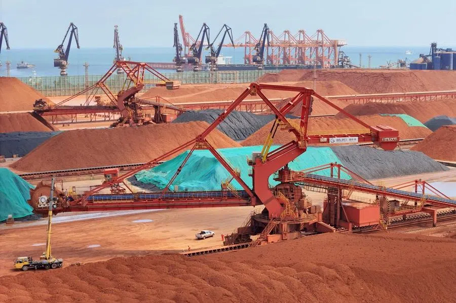 Imported iron ore, bauxite and coal is stored at Yantai Port, Shandong province, China, before being transported on 25 July 2025. (AFP)