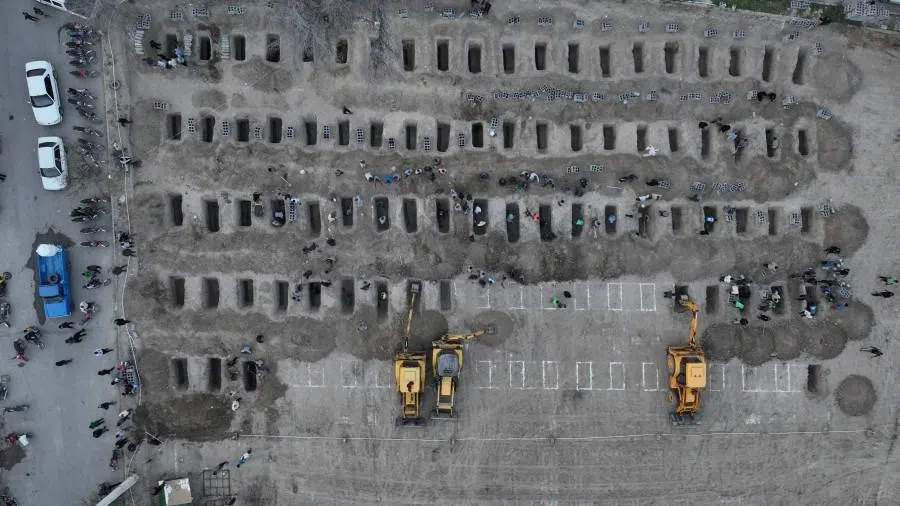Graves are being prepared for the victims following a reported strike on a school in Minab, Iran, on 2 March 2026.  (Iranian Foreign Media Department/WANA (West Asia News Agency)/Handout via Reuters)