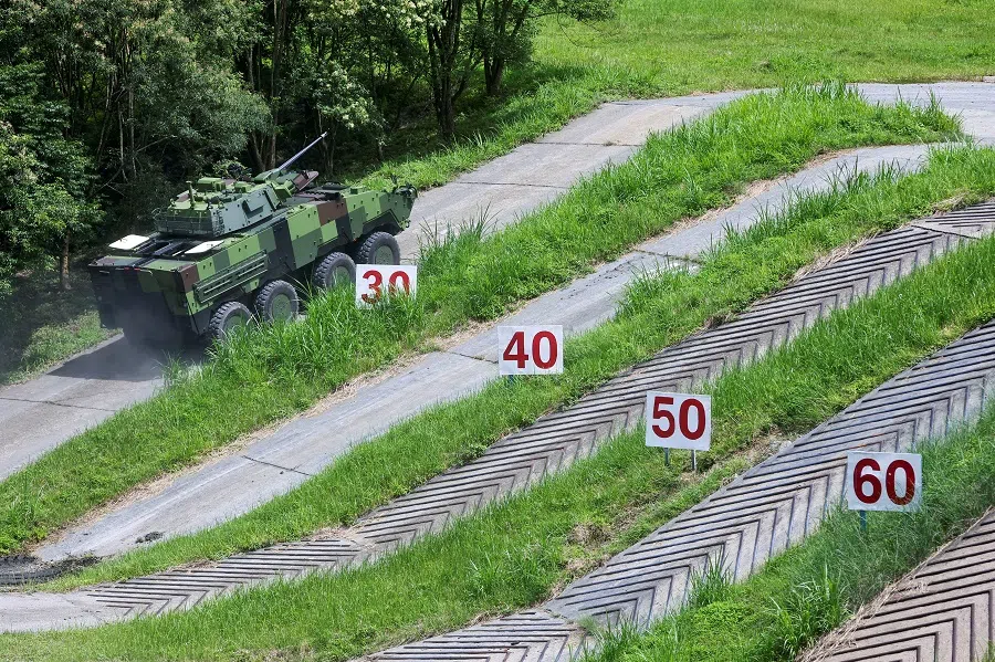 Taiwan military's latest armoured vehicle the CM-34 "Clouded Leopard" demonstrates driving on land with different incline and surface in Nantou, Taiwan, 16 June 2022. (Ann Wang/Reuters)