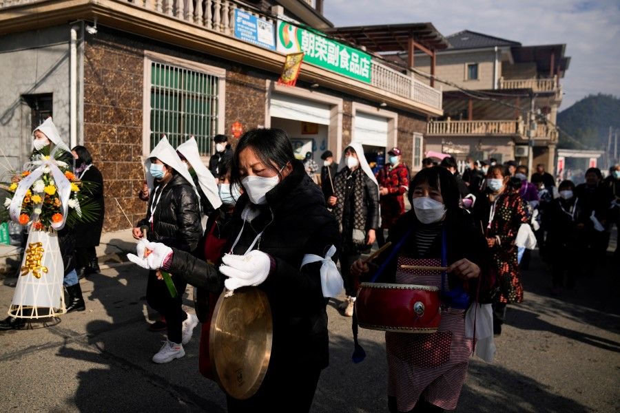 Relatives and neighbours attend the funeral of a woman surnamed Liu, as coronavirus disease (Covid-19) outbreak continues, at a village in Tonglu county, Zhejiang province, China, 9 January 2023. (Aly Song/Reuters)
