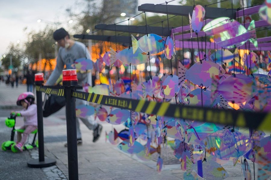 People walk past an art installation at the Ximen District in Taipei, Taiwan, on 3 February 2024. (Sam Yeh/AFP)