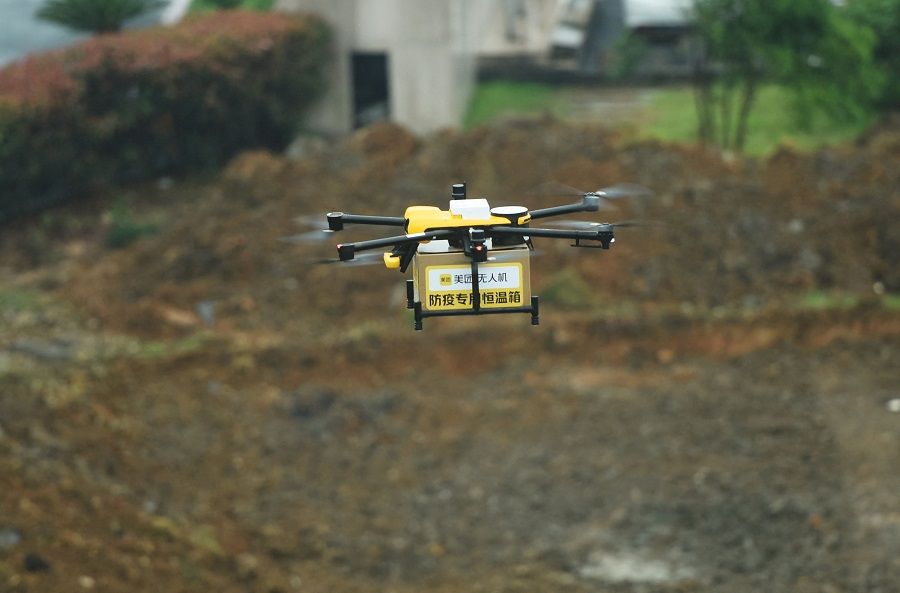 A delivery drone, transporting samples to be tested for the Covid-19 coronavirus, is seen in flight to a coronavirus testing facility in Hangzhou, Zhejiang province, China, on 24 May 2022. (AFP)