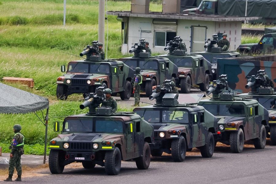 Military vehicles equipped with US-made TOW 2A missiles can be seen during a live fire drill in Pingtung, Taiwan, on 3 July 2023. (Ann Wang/Reuters)