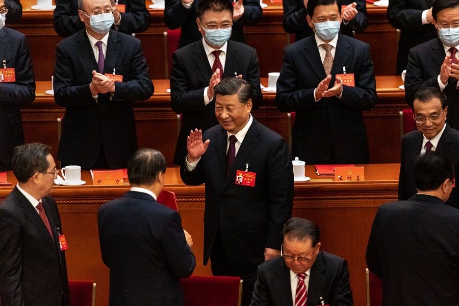Chinese President Xi Jinping greets some delegates as he leaves at the end of the closing session of the 20th Party Congress of the Chinese Communist Party at the Great Hall of the People in Beijing, China, on 22 October 2022. (Bloomberg)