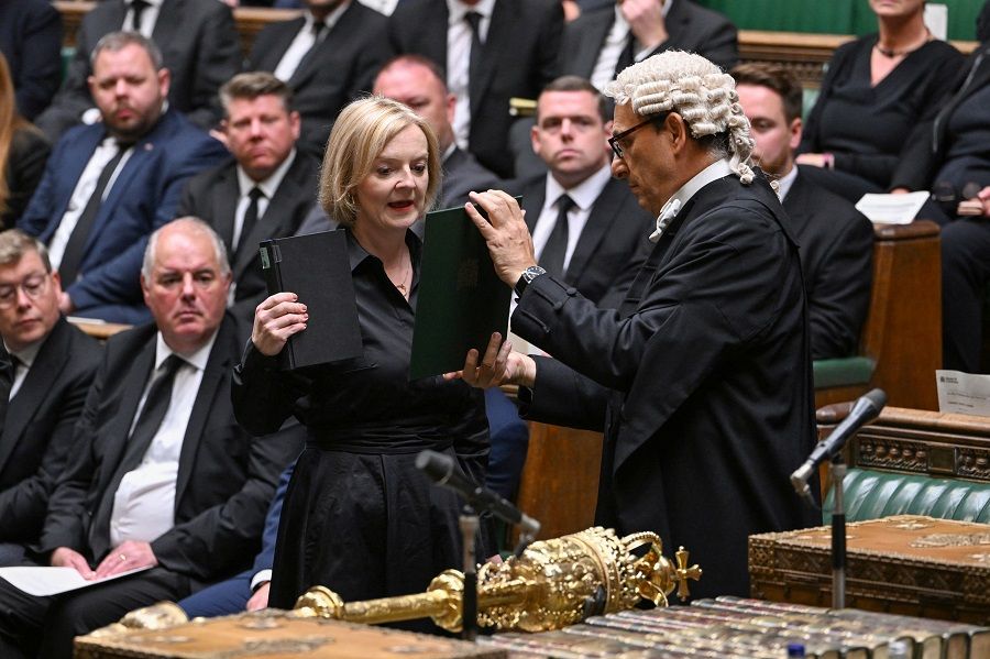 British Prime Minister Liz Truss takes the oath and swears allegiance to the Crown, His Majesty King Charles III, at the House of Commons in London, Britain, 10 September 2022. (UK Parliament/Jessica Taylor/Handout via Reuters)