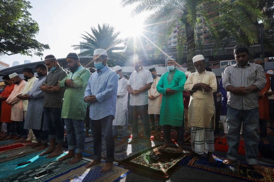 Muslims perform mass prayers at a mosque in Kuala Lumpur, Malaysia, 2 May 2022. (Hasnoor Hussain/Reuters)