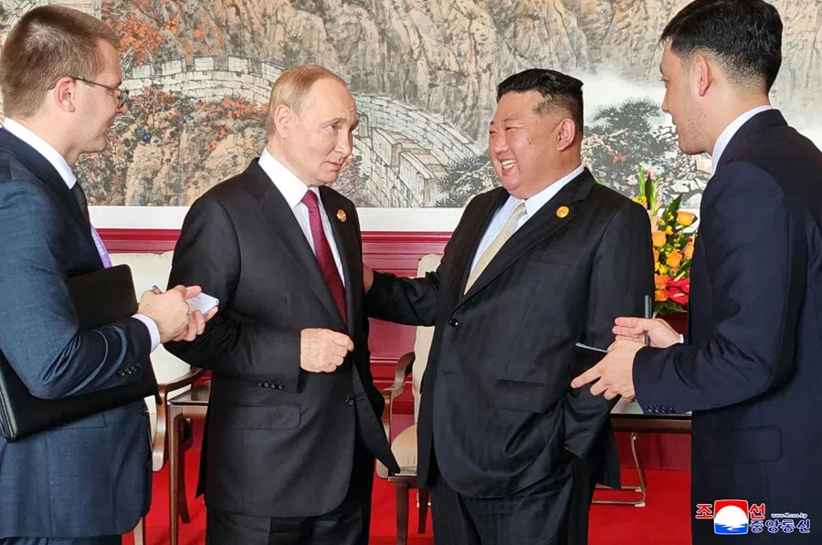 This picture taken on 3 September 2025 and released from North Korea's official Korean Central News Agency (KCNA) on 4 September 2025 shows North Korean leader Kim Jong Un speaking with Russia's President Vladimir Putin in Beijing.