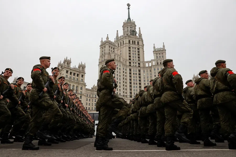Russian service members march in columns before a rehearsal for a military parade in central Moscow, Russia, on 26 April 2024. 