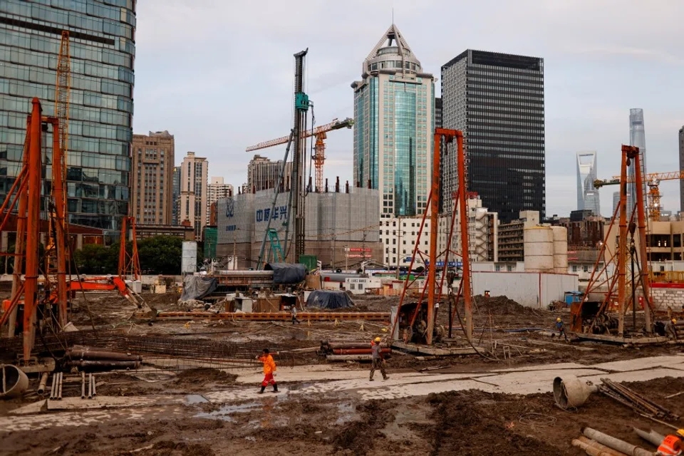 Labourers at a construction site in Shanghai, China, 12 July 2021. (Aly Song/Reuters)