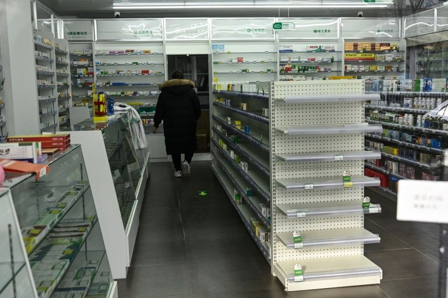 Near-empty shelves of medicine are seen at a pharmacy amid the Covid-19 pandemic in Beijing on 17 December 2022. (Jade Gao/AFP)