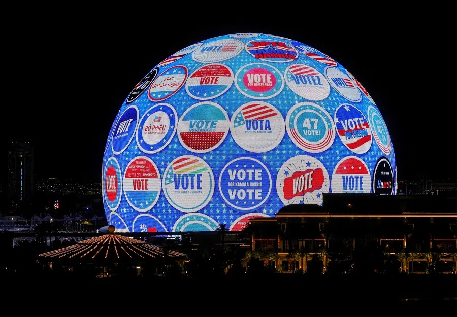 An advertisement for Democratic presidential nominee and US Vice President Kamala Harris and her running mate, Minnesota Governor Tim Walz, is displayed on the 580,000-square-foot Exosphere at Sphere, the first political campaign to do so, on 30 October 2024 in Las Vegas, Nevada. (Ethan Miller/Getty Images via AFP)