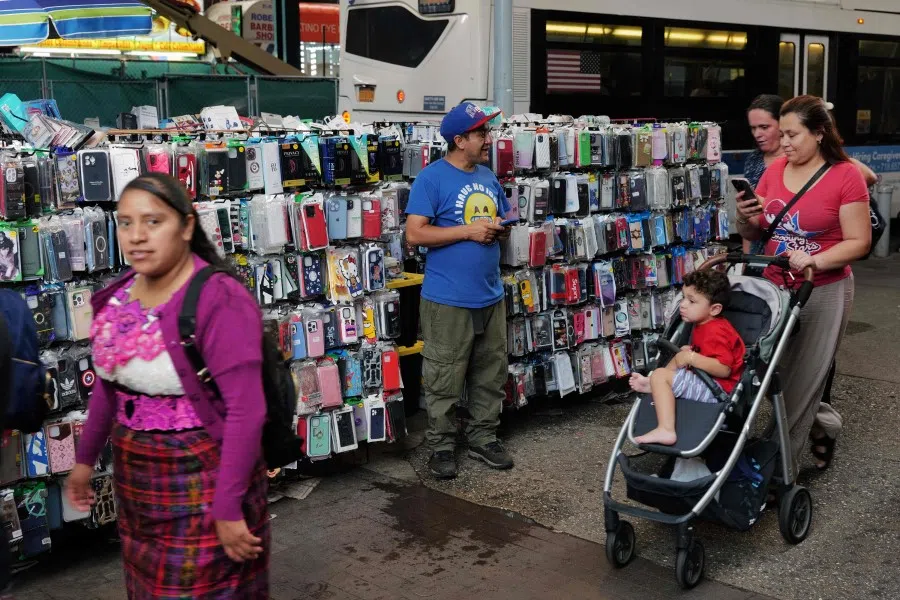 A street vendor along Roosevelt Avenue in Queens, an area with a high number of recent immigrants on 16 August 2023 in New York City. (Spencer Platt/Getty Images/AFP)