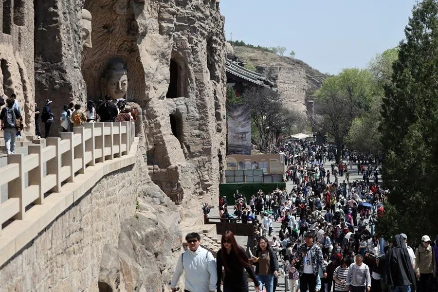 Tourists at the Yungang grotto in Datong city, Shanxi province, 30 April 2026.