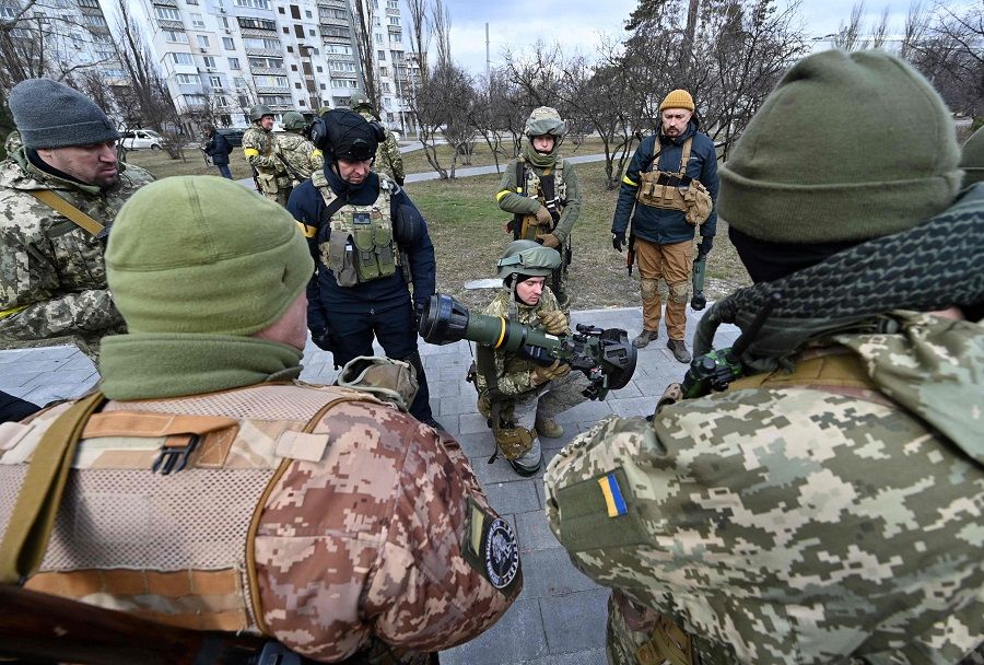 Members of the Ukrainian Territorial Defence Forces examine new armament, including NLAW anti-tank systems and other portable anti-tank grenade launchers, in Kyiv, Ukraine, on 9 March 2022, amid the ongoing Russian invasion of Ukraine. (Genya Savilov/AFP)