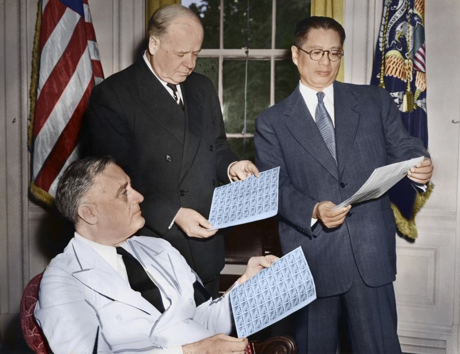 8 July 1942, White House - President Roosevelt, the US postmaster-general Frank Walker (middle), and ROC Minister of Foreign Affairs T.V. Soong looking at the newly marketed 5-cent "China Resistance" commemorative stamp.