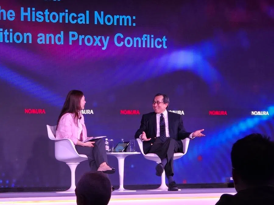 Bilahari Kausikan (right) speaks at a fireside chat on 3 June 2026 at Nomura Investment Forum Asia.
