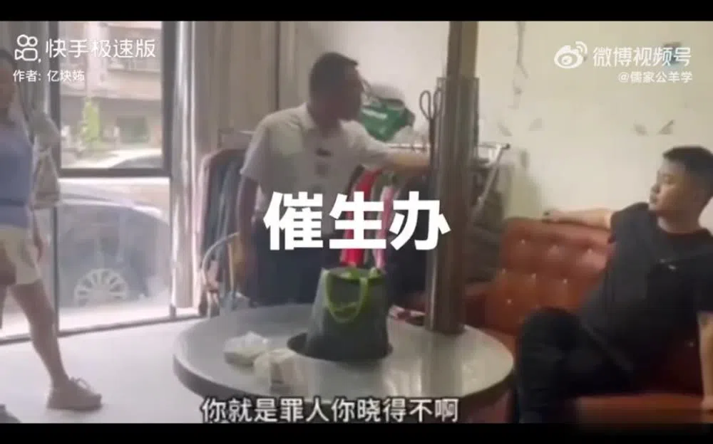 A screen grab from a viral video supposedly showing an employee from the “birth promotion office” berating a man for not having children.   (Internet)