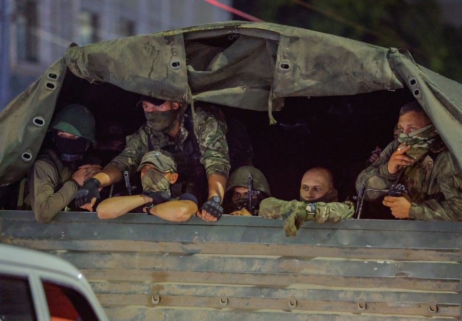 Fighters of Wagner private mercenary group pull out of the headquarters of the Southern Military District to return to base, in the city of Rostov-on-Don, Russia, 24 June 2023. (Alexander Ermochenko/Reuters)