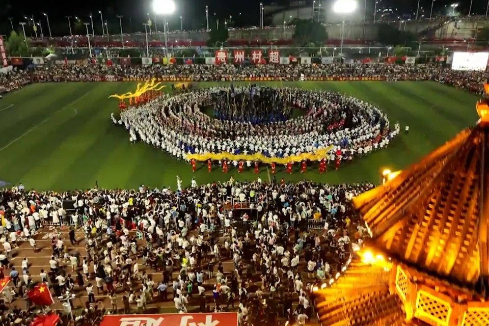 An aerial view of over 10,000 villagers celebrating following the finals of “Village Super League” (村超) in Rongjiang county, Guizhou province, on 29 July 2023 (Screen grab from CNS)