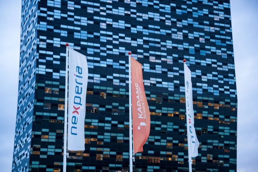 Banner flags with the Nexperia Holding BV logo outside their headquarters in the 52Nijmegen high-rise building on the Noviotech Campus in Nijmegen, Netherlands, on 24 October 2025.