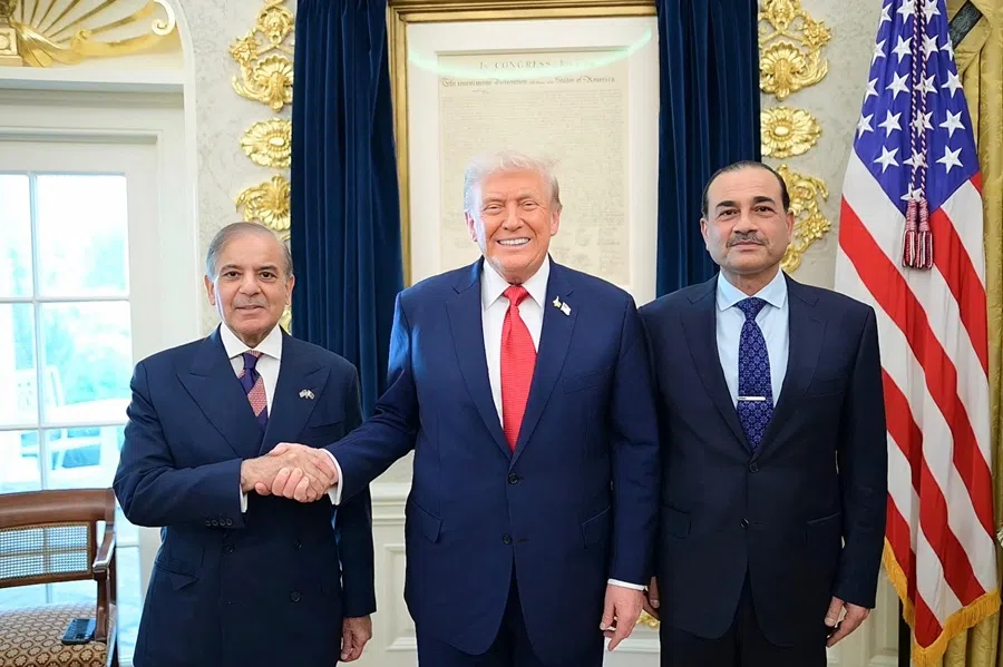 This handout photograph released by Pakistan's Prime Minister Office on 26 September 2025, shows Pakistan's Prime Minister Shehbaz Sharif (L), Army Chief and Field Marshal Syed Asim Munir (R) posing with US President Donald Trump (C) at the White House in Washington, DC. (Pakistan’s Prime Minister Office/AFP)