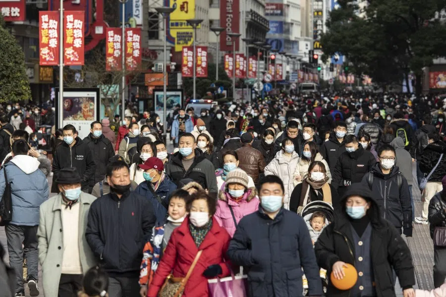Pedestrians on Nanjing Road in Shanghai, China, on 2 February 2022. (Qilai Shen/Bloomberg)