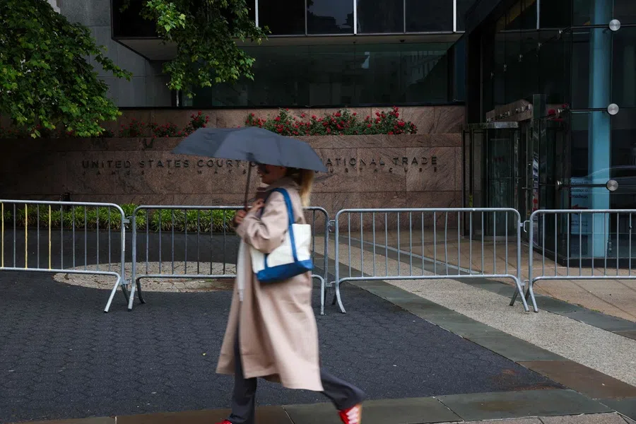 A person walks past the The United States Court of International Trade in lower Manhattan on 29 May 2025 in New York City. In a ruling that surprised many, the Manhattan-based trade court ruled in an opinion by a three-judge panel that a 1977 law called the International Emergency Economic Powers Act (IEEPA) does not grant President Donald Trump “unbounded” authority to impose the worldwide and retaliatory tariffs he has recently issued by executive order.   (Spencer Platt/Getty Images via AFP)