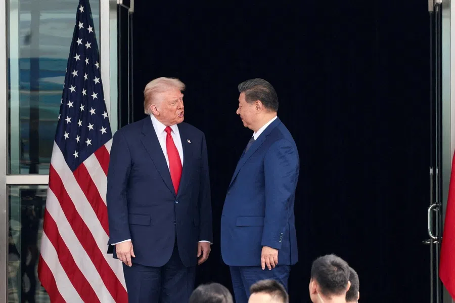 US President Donald Trump and Chinese President Xi Jinping talk as they leave after a bilateral meeting at Gimhae International Airport, on the sidelines of the Asia-Pacific Economic Cooperation summit, in Busan, South Korea, on 30 October 2025. (Evelyn Hockstein/Reuters)