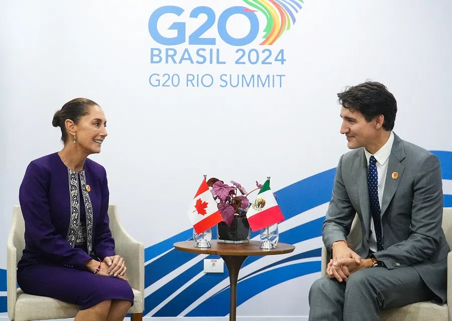 Handout picture released by Mexico’s Presidency press office showing Mexico’s President Claudia Sheinbaum talking with Canada’s Prime Minister Justin Trudeau during a bilateral meeting on the sidelines of the G20 summit in Rio de Janeiro, Brazil, on 18 November 2024. (Handout/Mexico’s Presidency press office/AFP)