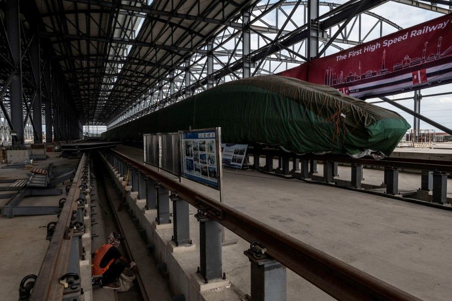 An Electric Multiple Unit high-speed train for a rail link project, which is part of China's Belt and Road Initiative, is seen at the Tegalluar train depot construction site in Bandung, West Java Province, Indonesia, 1 October 2022. (Antara Foto/Aprillio Akbar/via Reuters)