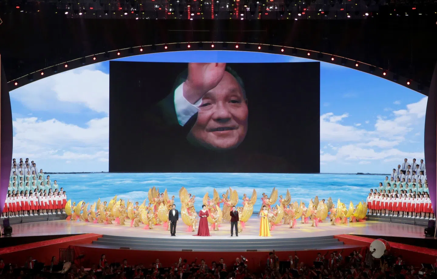 A picture of late Chinese leader, Deng Xiaoping, who led China's reform and opening up, is seen on a giant screen during a cultural performance in Macau, China. (Jason Lee/Reuters)