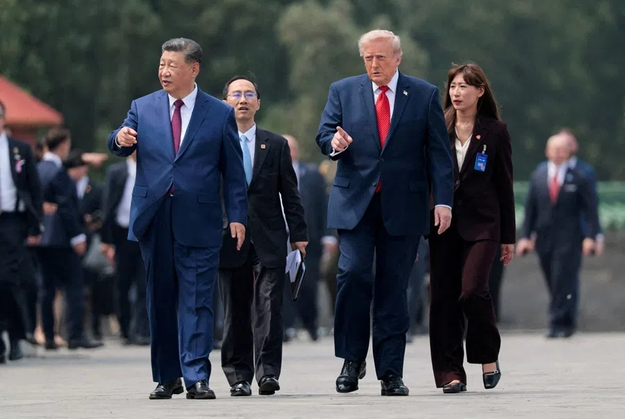 US President Donald Trump and Chinese President Xi Jinping walk together as they tour the Temple of Heaven in Beijing, China, on 14 May 2026.