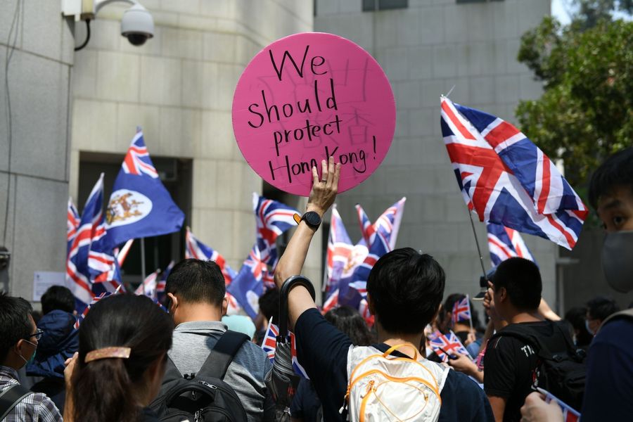 Hong Kong has always enjoyed its status as a globalised city with extensive external networks. The existence of long-term foreign powers in Hong Kong is thus unsurprising. Hong Kongers preferred to maintain the status quo under the UK's competent rule. (Mohd Rasfan/AFP)