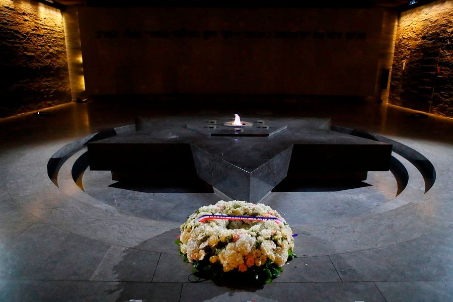 In this file photograph taken on 19 February 2019, a wreath of flowers lies at The Shoah Memorial, a Holocaust museum in Paris, ahead of the arrival of the French President. (Francois Mori/POOL/AFP)