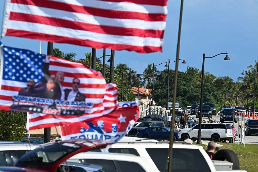 Supporters of US President-elect Donald Trump cheer as his motorcade departs from his residence Mar-a-Lago Club in Palm Beach, Florida, US, on 8 January 2025. (Chandan Khanna/AFP)