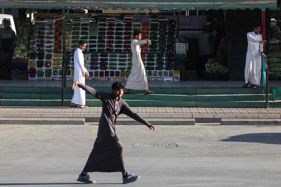 Vendors selling goods for Iftar try to attract customers at a market in Riyadh on 18 February 2026, on the first day of the holy fasting month of Ramadan in Saudi Arabia. (Fayez Nureldine/AFP)
