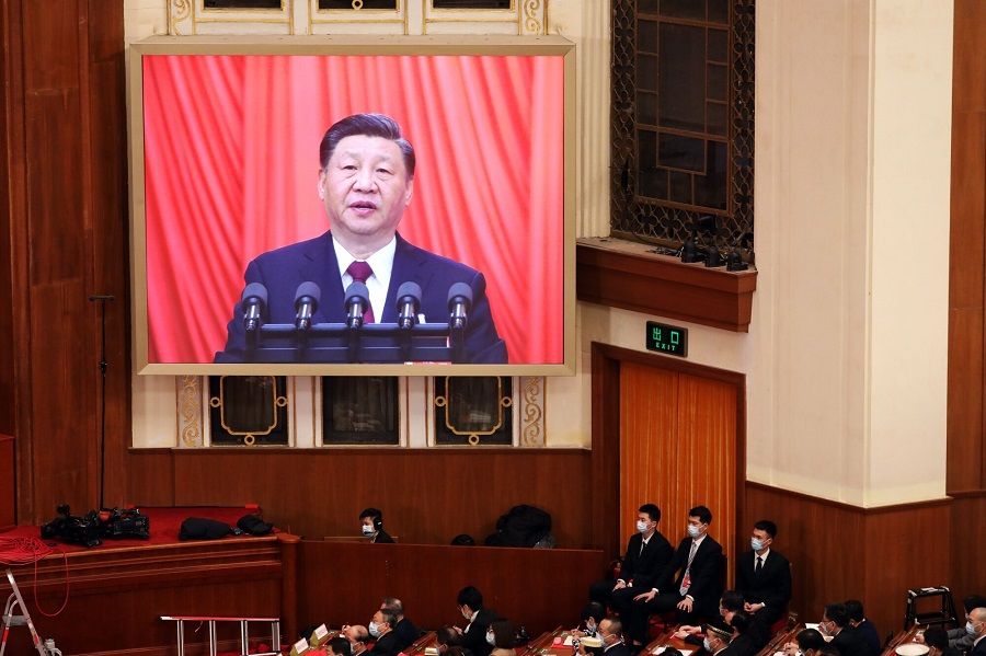 A screen shows Chinese President Xi Jinping speaking during the closing session of the First Session of the 14th National People's Congress (NPC) at the Great Hall of the People in Beijing, China, on 13 March 2023. (Qilai Shen/Bloomberg)