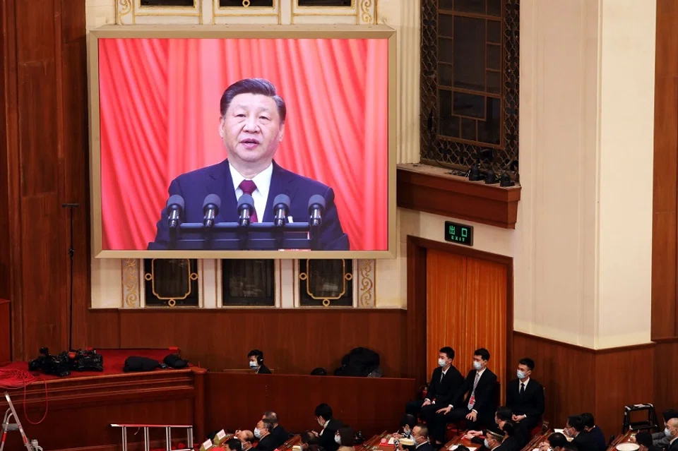 A screen shows Chinese President Xi Jinping speaking during the closing session of the First Session of the 14th National People's Congress (NPC) at the Great Hall of the People in Beijing, China, on 13 March 2023. (Qilai Shen/Bloomberg)