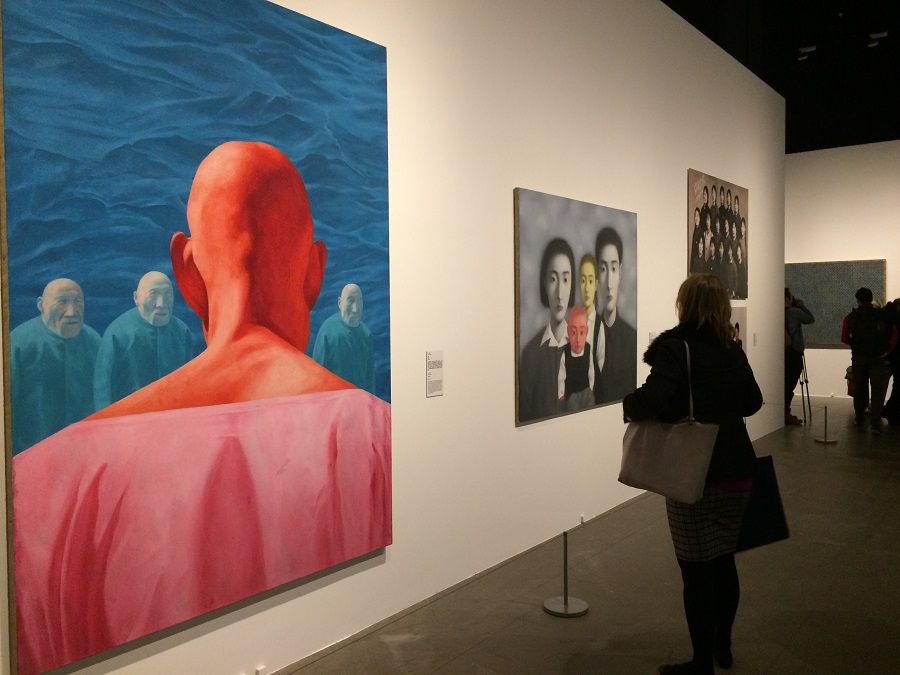 Visitors looking at Chinese contemporary art at the Sigg Collection exhibition, Art Basel Hong Kong 2016. (Photo: Chow Yian Ping)