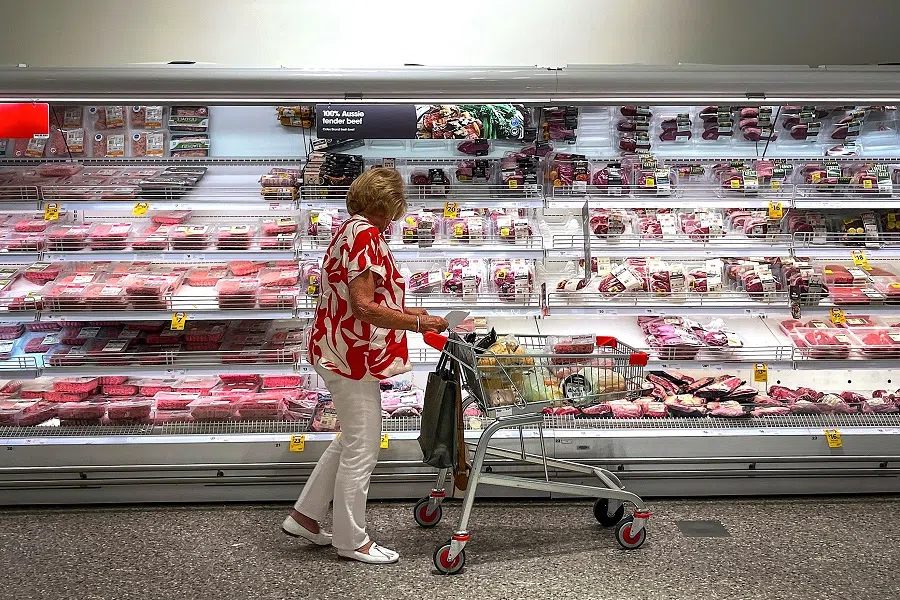 A shopper looks at Australian beef products for sale at a supermarket in Sydney on 3 April 2025. (David Gray/AFP)