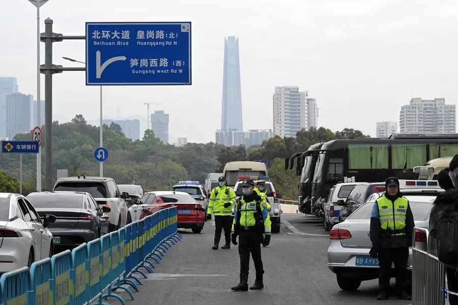 Police officers work outside a hotel in Shenzhen, Guangdong province, on 24 January 2024. (Pedro Pardo/AFP)